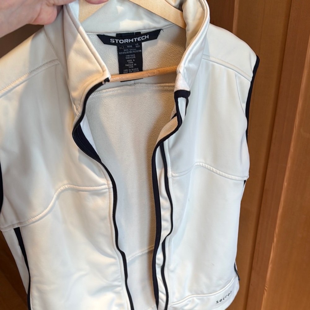 Ptp23” Stormtech White Vest with Black Trim